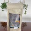 Parte trasera del empaque de "Patas Muyo Natural", con información sobre el origen del producto, sus beneficios nutricionales y un precio de $7.00.